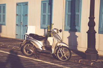 Fototapeta na wymiar Old fashioned motorbike on a street of Procida Island, Italy