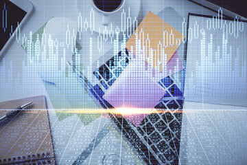 Multi exposure of financial chart drawing over table background with computer. Concept of research and analysis. Top view.