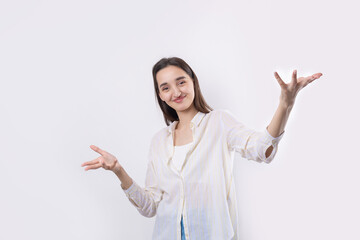 Young beautiful woman with facial expression of surprise standing over white background.