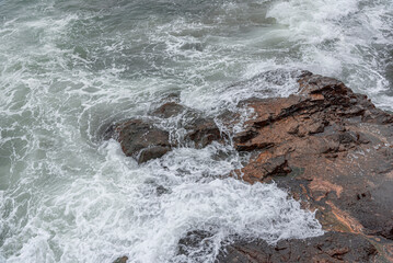 Storm sea. Waves on the sea dispersed by the wind on a cloudy day.