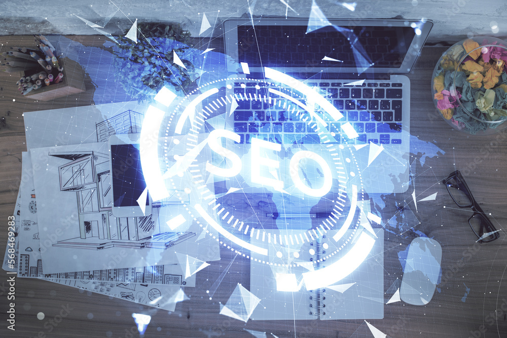 Poster Double exposure of SEO drawing over study table background with computer. Concept of search. Top view.