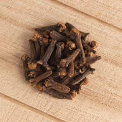 Cloves on the wooden background