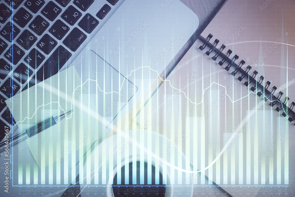 Poster stock market graph and top view computer on the table background. double exposure. concept of financ