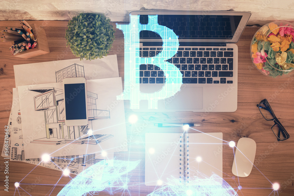 Poster Blockchain theme hologram drawings over computer on the desktop background. Top view. Double exposure.