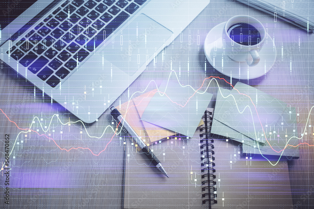 Aufkleber Stock market graph and top view computer on the table background. Double exposure. Concept of financial education.