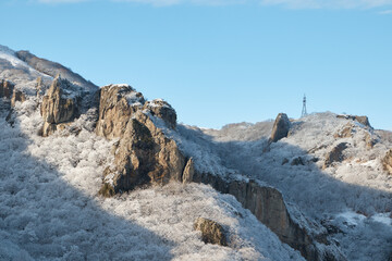 Dombay, alps, snow-covered slopes, the first snow in the mountains, sun and good weather, winter ski season