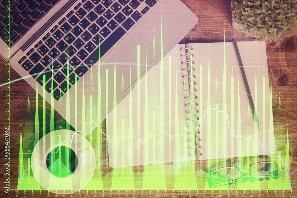 Poster financial market graph and top view computer on the desktop background. double exposure. investment 
