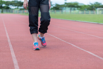 Fototapeta premium beautifull sport girl exercise at the track court and wearing blue sport bra