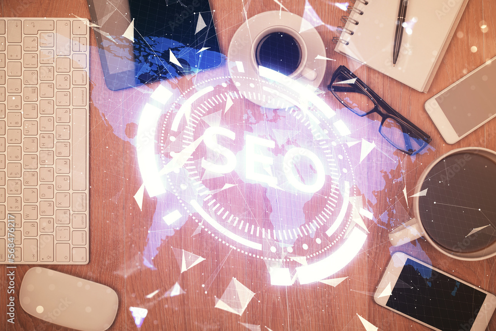 Poster double exposure of seo hologram drawing over desktop. top view. search optimization concept.