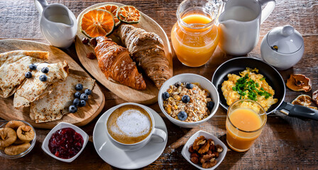 Breakfast served with coffee, eggs, cereals nd croissants