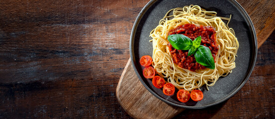 Composition with a plate of spaghetti bolognese