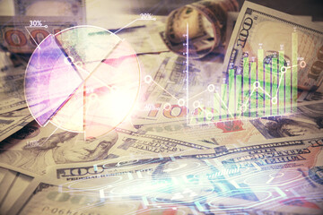 Multi exposure of forex chart drawing over us dollars bill background. Concept of financial success markets.