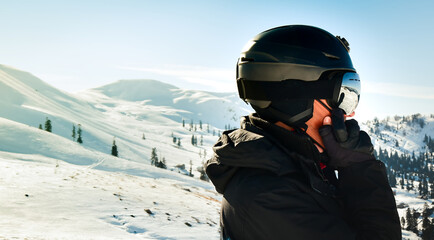 Fototapeta na wymiar Excited skier man in black jacket ski goggles mask text friends shot on mobile phone spend weekend winter in mountains isolated on purple background. People lifestyle hobby concept