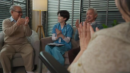 asian senior people applauding for oldman in group therapy session - Powered by Adobe