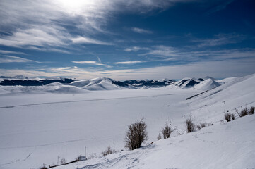 Monte Vettore and Piana di Castelluccio covered with fresh snow. The concept of strong powerful nature is expressed with a sense of freedom and silence