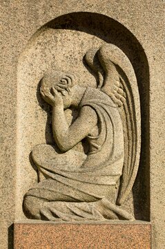 Closeup of a stone carving of a angel in cemetery, Halikko, Finland.