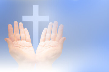Catholic cross over palms of believer. Christian denomination. Religious catholic hands on blue....