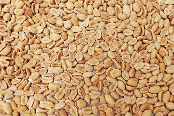 close up of peeled roasted peanuts, healthy nuts, protein food. Isolated background of roasted peanuts. Vegan food and protein nutrition.