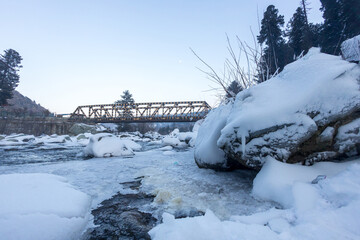 Forest and mountain in Winter Season. The snow-covered fields. Awesome Beautiful tourism winter vacation background 