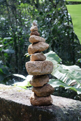 Zen stones stack in walking path through tropica rainforest, South America 