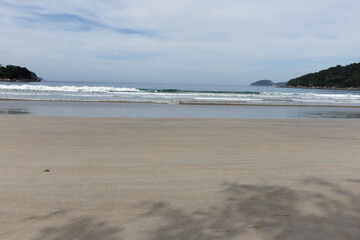 Desert tropical beach, near the forest in Dois Rios, Brazil. Amazing beach with endless horizon. Background and Atlantic Ocean. Relax natural tranquility, inspirational shore coast and sand drawings.