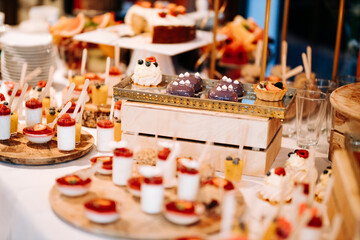Dessert sweets wedding candy bar sweet table delicious cookies cakes macaroons cupcakes ceremony party pastry food restaurant cake pops