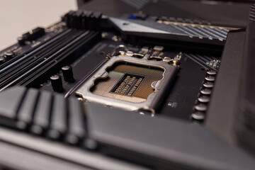 Computer Motherboard with empty and open CPU socket.