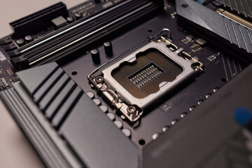 Computer Motherboard with empty and open CPU socket.