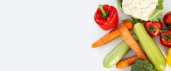 Fresh vegetables on a light background. Top view, flat lay. Banner