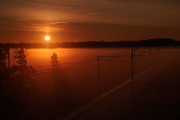 sunrise over the foggy field