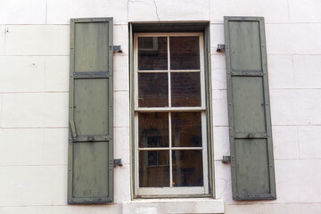 Window with iron shutters in historic California building