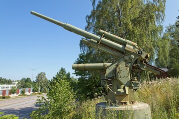 WW2 anti-aircraft gun memorial at Hyrylä in clear weather in summer, Tuusula, Finland.