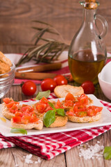 Friselle with cherry tomatoes and basil.