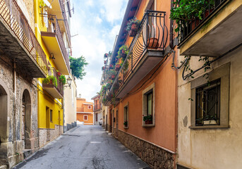 beautiful narrow medeterranean street with vintage buildings , beautiful windows and picturesque...