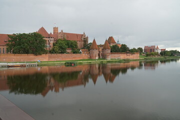 Fototapeta na wymiar Tower of the Templar castle on the banks of the Vistula River in Malbork, Poland.