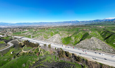 A UAV Aerial view of the I-10 Freeway to Redlands and Yucaipa, California, through Reservoir Canyon...