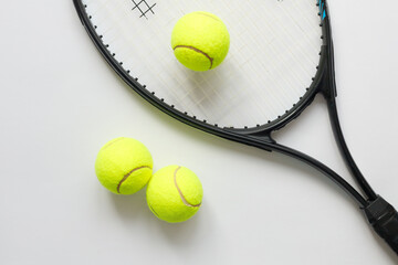 Big tennis sports equipment, racket and balls, layout on a white background. Still life Sports.