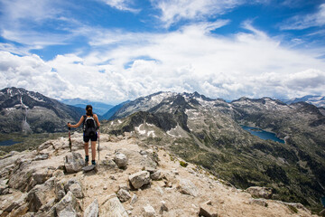 Fototapeta premium Young hiker girl summit to Montardo Peak in AIguestortes and Sant Maurici National Park, Spain
