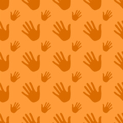 Obraz premium Seamless pattern handprints, isolated on orange background.