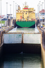 Cargo ship transiting the Miraflores locks in the Panama Canal in Central America