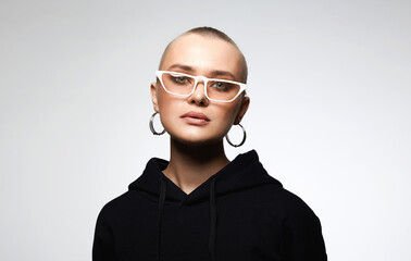 Fototapeta na wymiar beautiful young woman wearing Hoodie and glasses