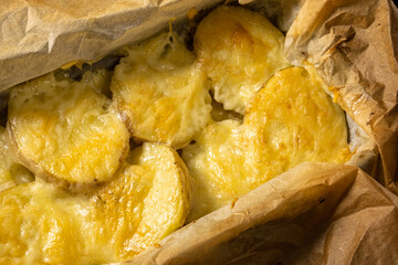 Baked potatoes with cheese, a ready-made dish in a baking sheet