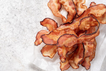 Crispy Cooked bacon rashers on parchment
