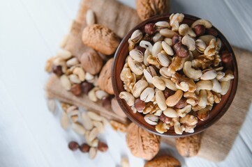 Mixed nuts on a plate. White background
