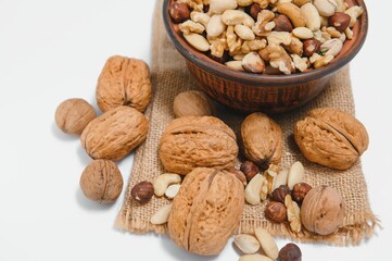 Mixed nuts on a plate. White background