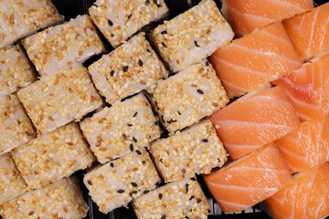 Sushi set in a plastic container with salmon, tuna, Japanese cuisine
