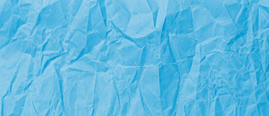 Сrumpled blue baking paper sheets isolated on white background, top view. Empty space for your message. Ripped paper, space for advertising copy