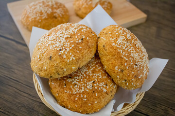 Keto buns, Low carb buns baked with psyllium husk and flax seeds in basket. Ketogenic diet and gluten free bread. Healthy eating concept, selective focus.