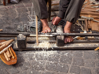 Craftsman working wood in a workshop of Marrakech