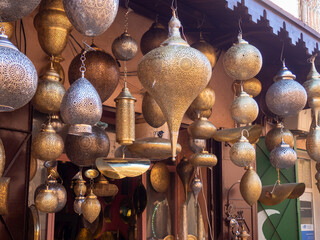 Moroccan style hanging lamps in the medina traditional market. Lights and souvenir shops Marrakech
